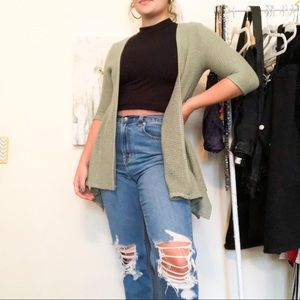 Francesca’s light green cardigan